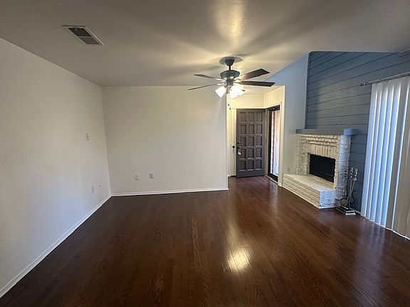 Living area with sliding glass doors and fireplace