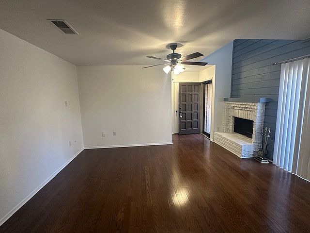 Living area with sliding glass doors and fireplace