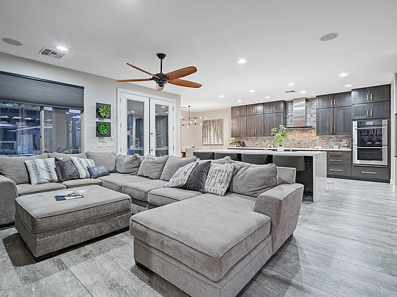 Living room and kitchen area. Large comfy couch