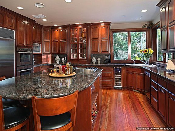 Cherry hardwoods and cabinets with granite counter tops