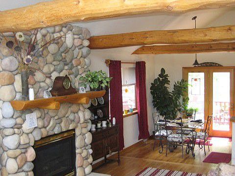 Log beam accents. Gleaming hard wood floors!