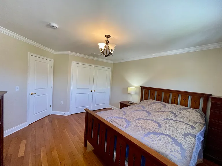 Sunny secondary bedroom with ample closet space