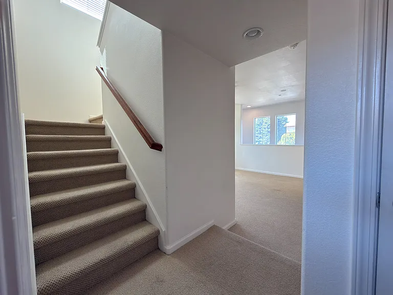 Stairs To Level 2 + Living Room