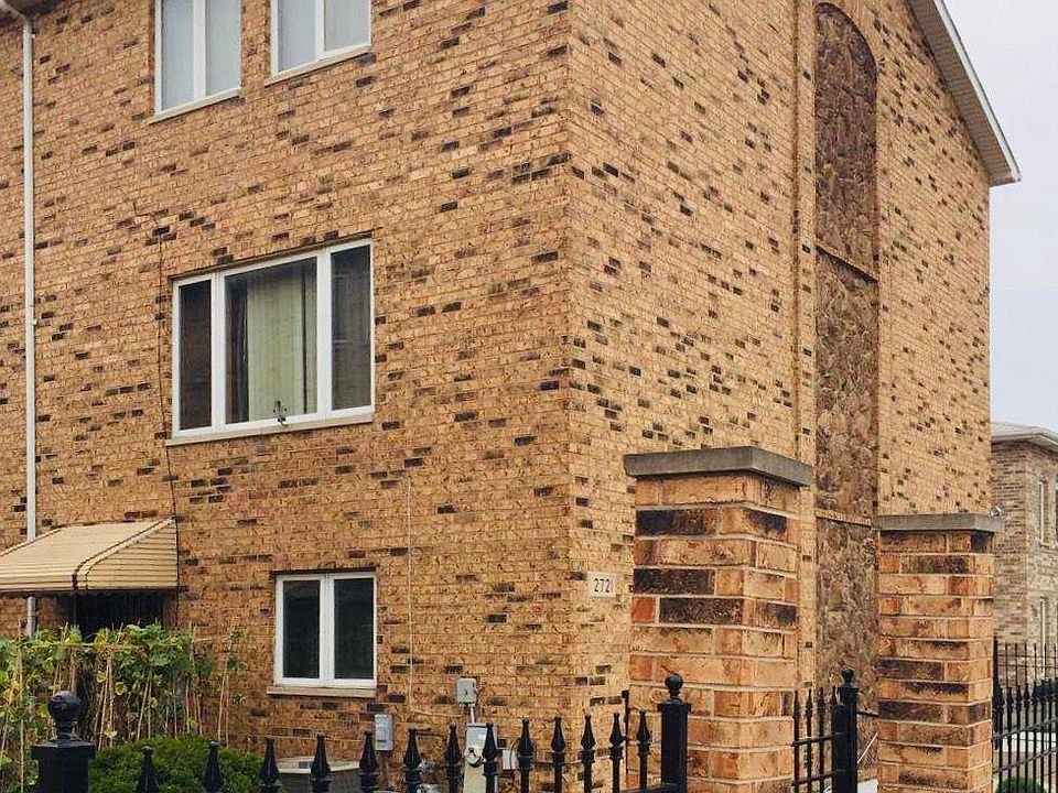 Outdoor facade of 2721 S Quinn Unit A. This townhouse is connected with three other units.