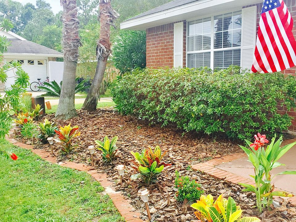 The yard has a variety of tropical perennials for lots of color.