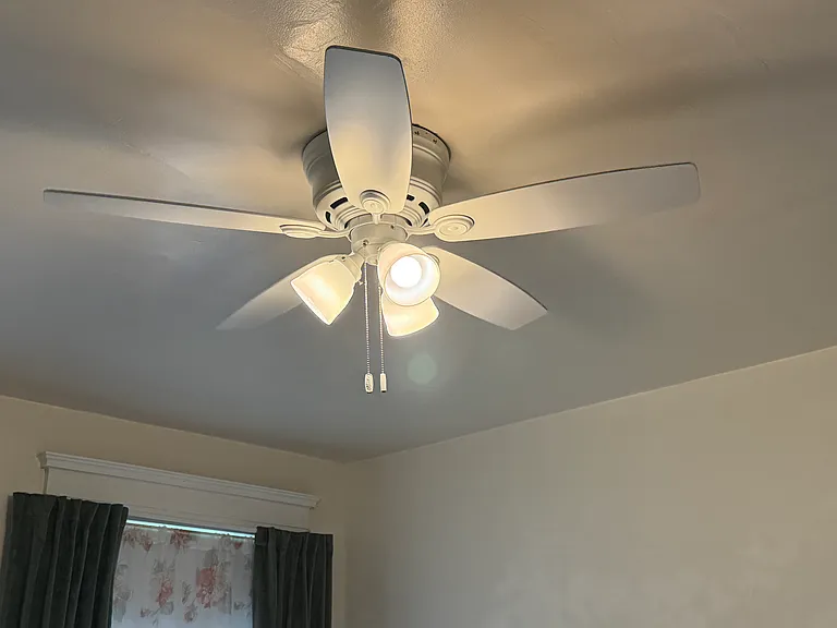 Both bedrooms have ceiling fans with lights.