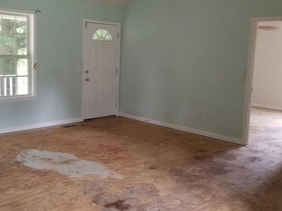 Living room has cathedral ceiling