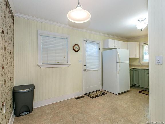 Refrigerator included, door goes to small landing and to side yard.