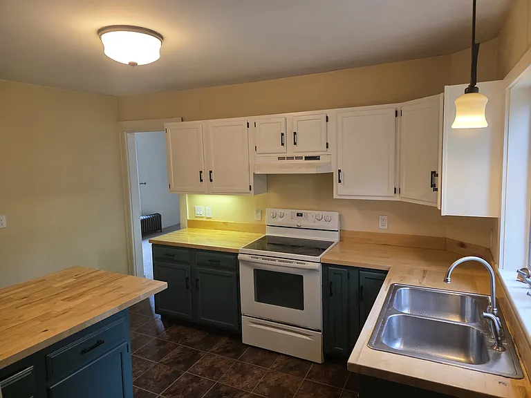 Just painted kitchen with new hardware. Counters installed 2022.