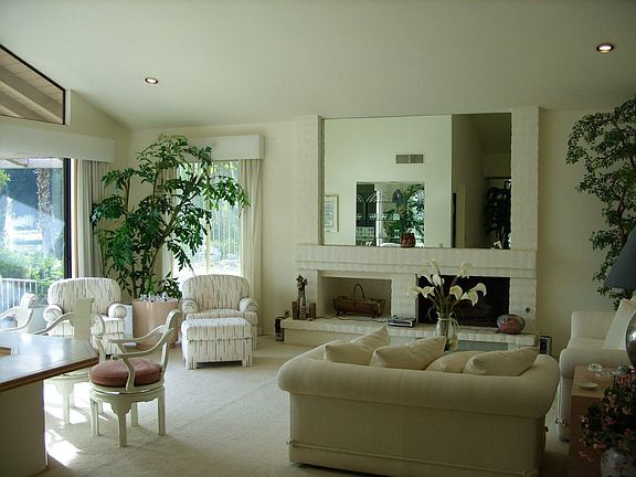 Inviting Living Room w/ Fireplace & Built-In Wet Bar