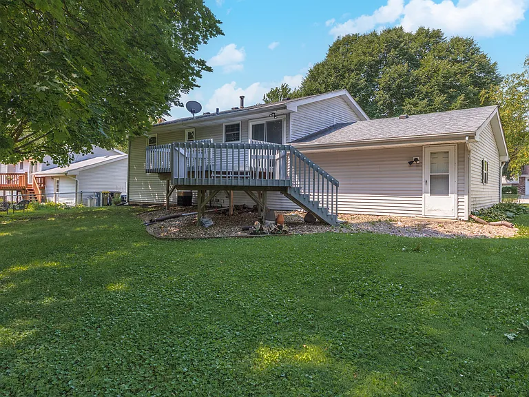 Spacious backyard for making memories. Great natural shade.