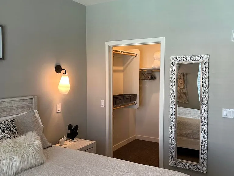 large walk in closet off of bedroom