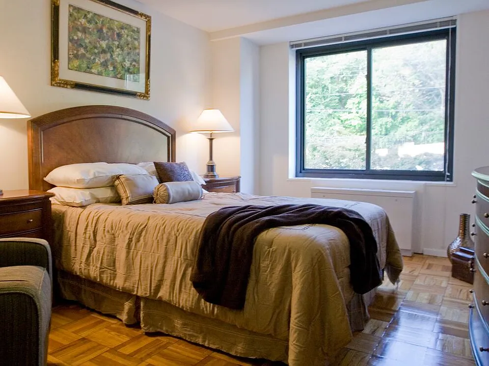 Bedroom with parquet flooring