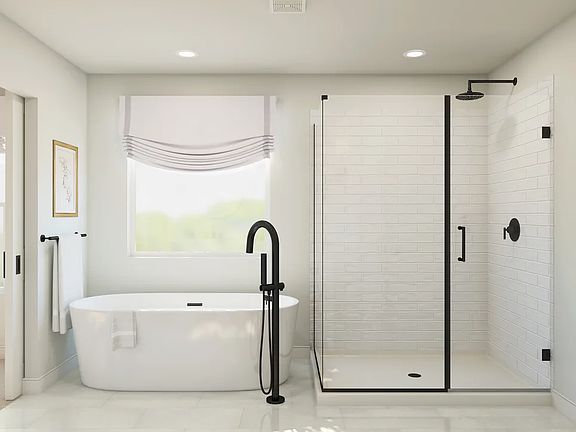 Primary bath with freestanding tub and glass shower enclosure