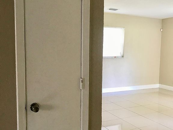 pantry door next to family room and kitchen