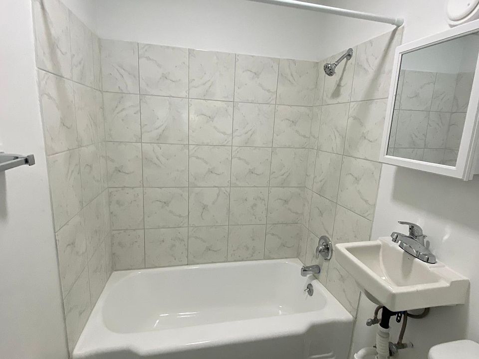 bathroom with brand new toilet, tub, floor, tiles- everything!