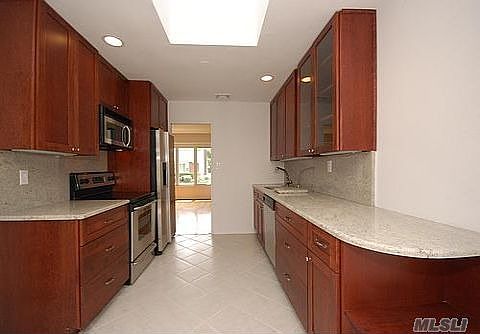 Brand New EIK w/Custom cherrywood cabinets with granite counter tops
