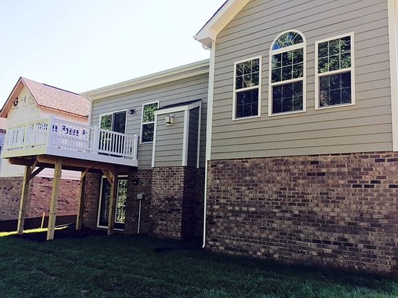 Back of house, walk out basement, deck, small yard