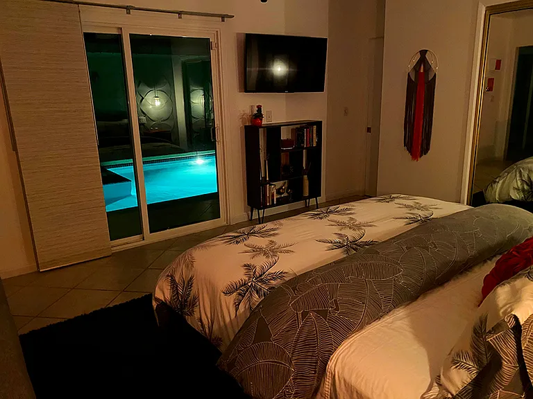 Orange Bedroom: California King size bed, ensuite bathroom, pool view and access