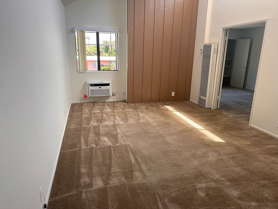 Front Entrance looking toward living room. Bedroom door to the right