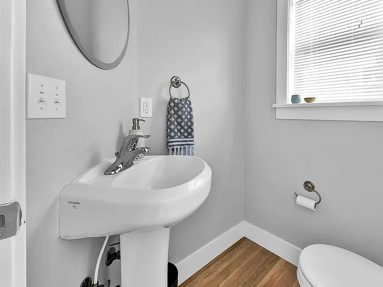 Half bath off Dining Room, upstairs.