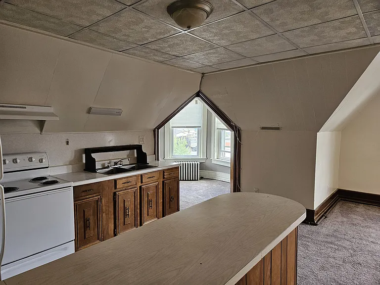 Kitchen area view left towards small bonus room