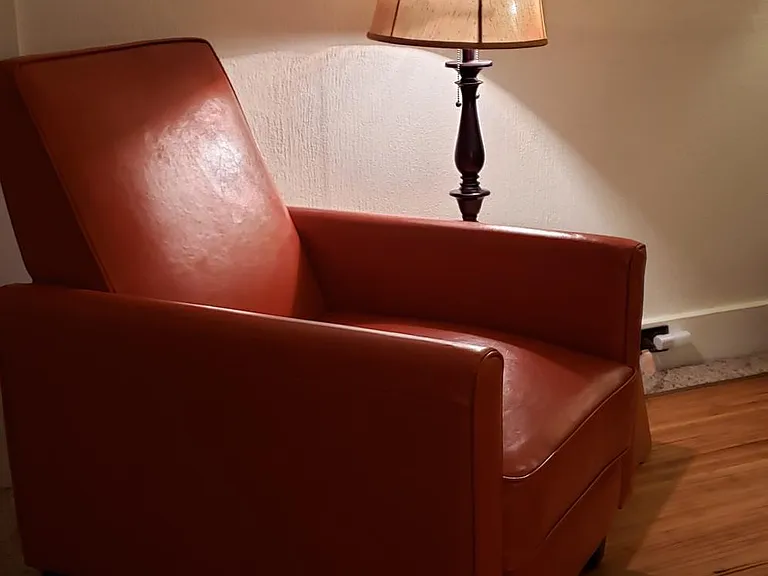 A favorite spot. Orange leather recliner... nap initiator.