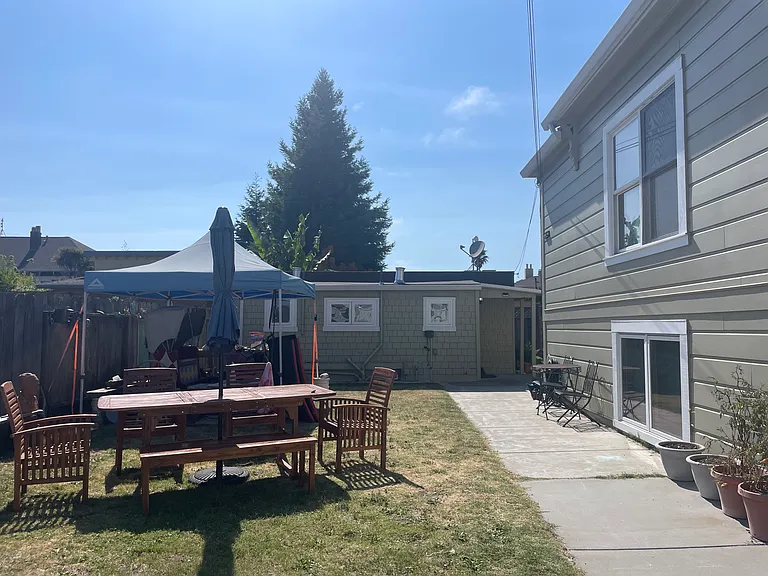 The cottage sits in the backyard of the front house. That family has access to the side yard right next to the cottage.
