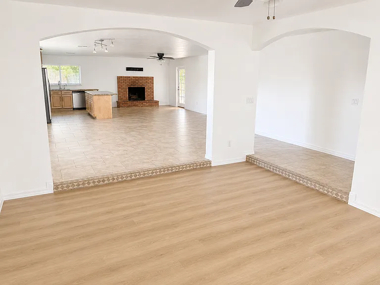 View from front sunken Living Room into open concept Den, Kitchen & Dining Areas