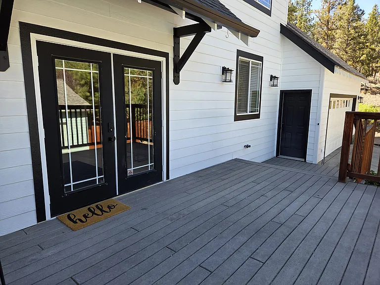 Side deck, french-door entry and garage door entry.