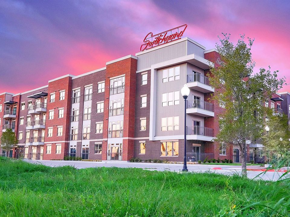 Building exterior at night with Switchyard marquee sign