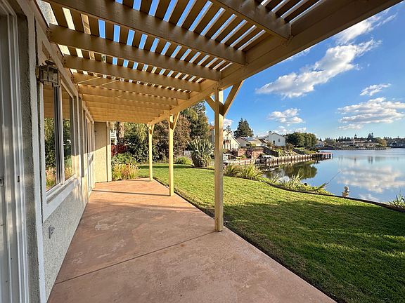 covered patio off family room and master bedroom