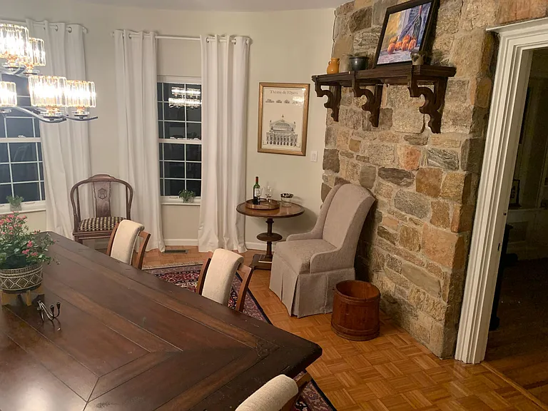 Circular dining room with table to accommodate 10 or more. Original stone was & panoramic windows