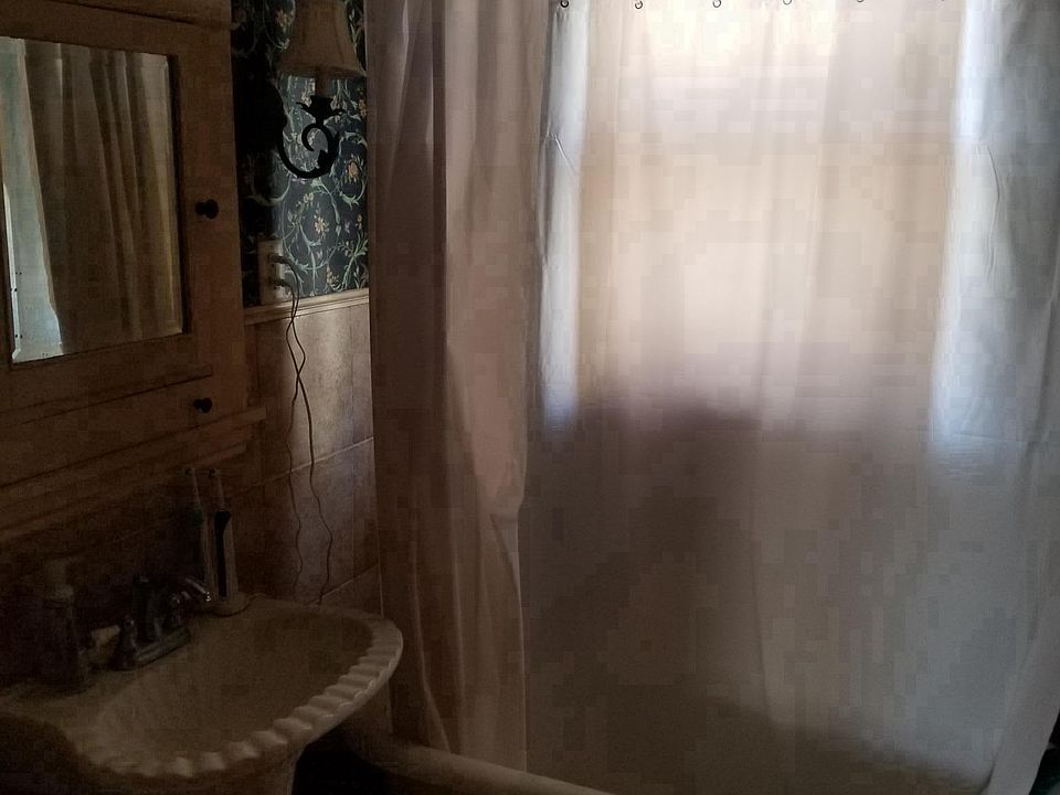 Main level bath with original clawfoot tub