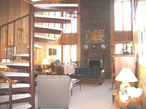 Looking from the wet bar into the living room and fireplace. 