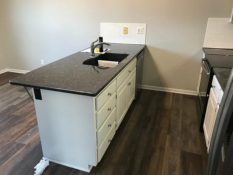 Kitchen with top overhand for additional bar stools