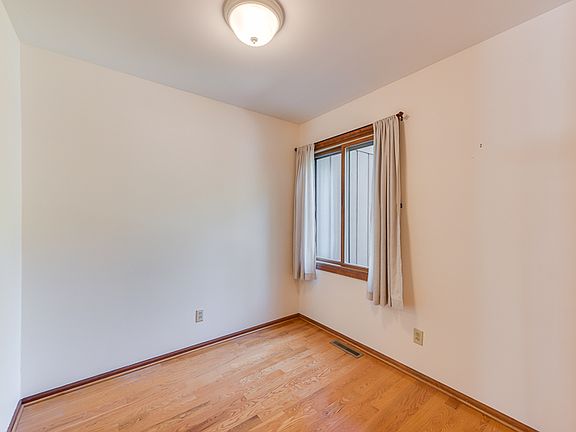 The casual eat in area with wood flooring.