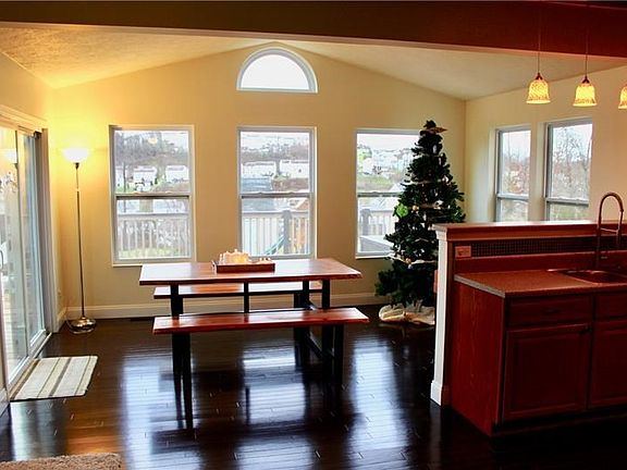 Dining Room Off of Kitchen with Door to Deck