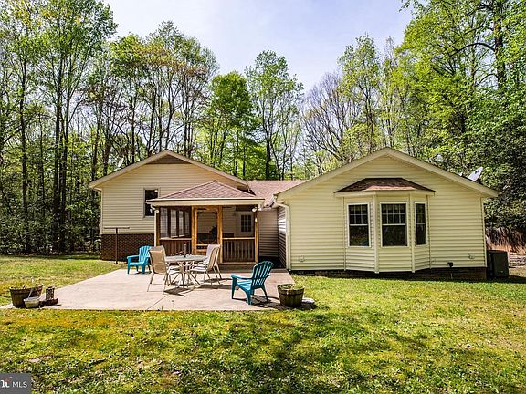 Back view showing screened porch & patio