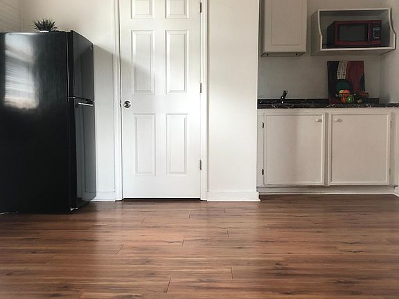Living/dining room area with kitchenette.