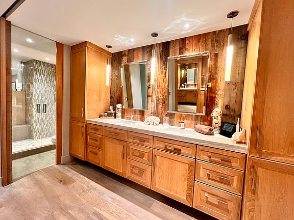 Two vanities with custom cabinetry.