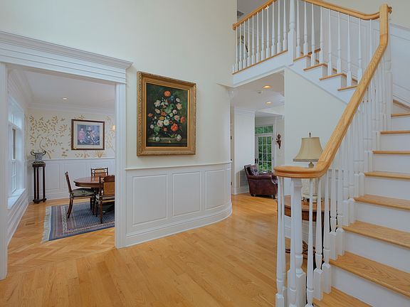 Entry foyer looking towards dining room, family room and up to the second floor