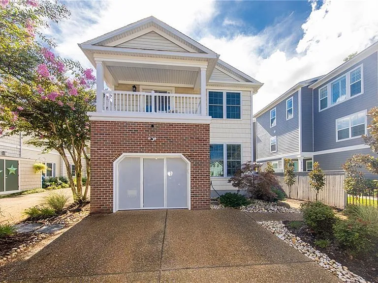 Street view with parking for two, two landscaping visits included in rent to keep the property looking great all year long.