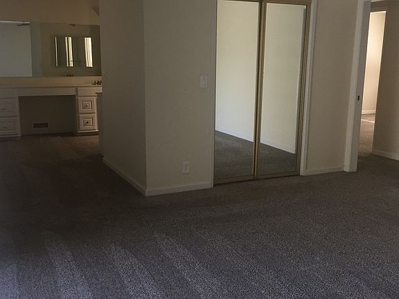 The master bedroom has a separate space with a mirror and va