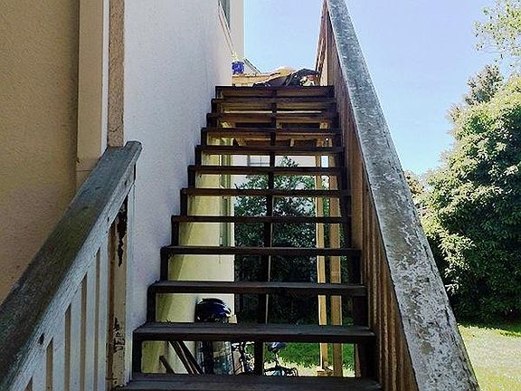 Steps leading to the balcony and front door