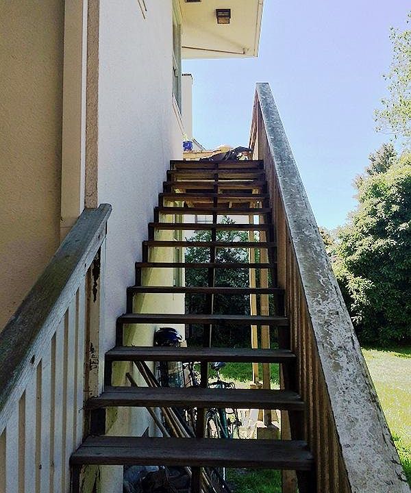 Steps leading to the balcony and front door