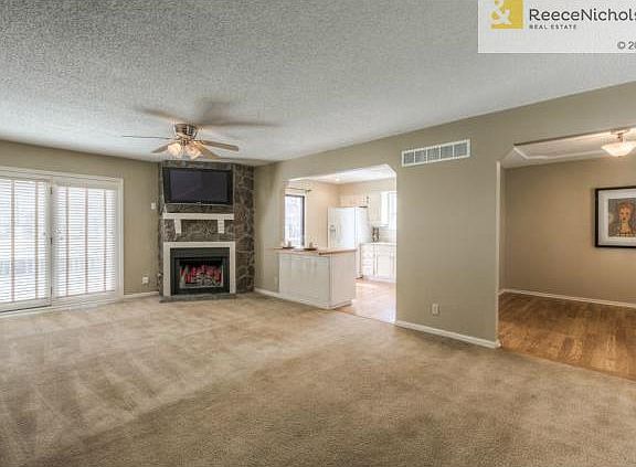 Spacious great room has atrium door to deck and gas starter fire