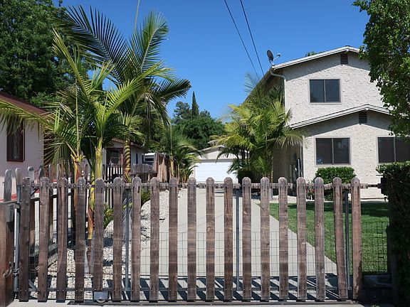 Gated Driveway to Garage and Backyard
