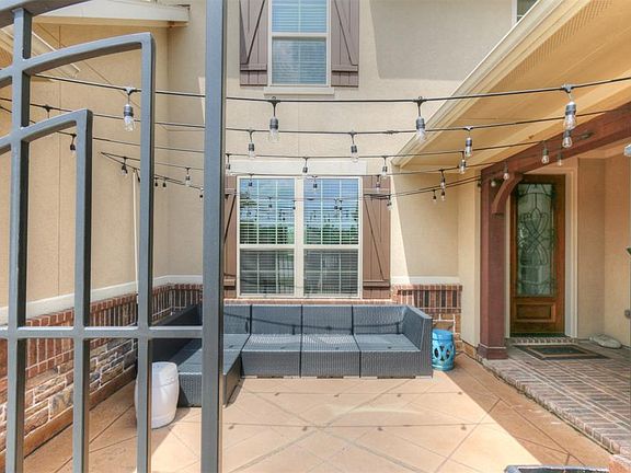 Wrought iron gates open to your courtyard entry.
