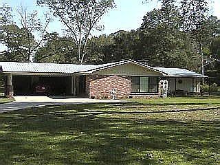 Beautiful mostly brick house with metal roof in historical district.